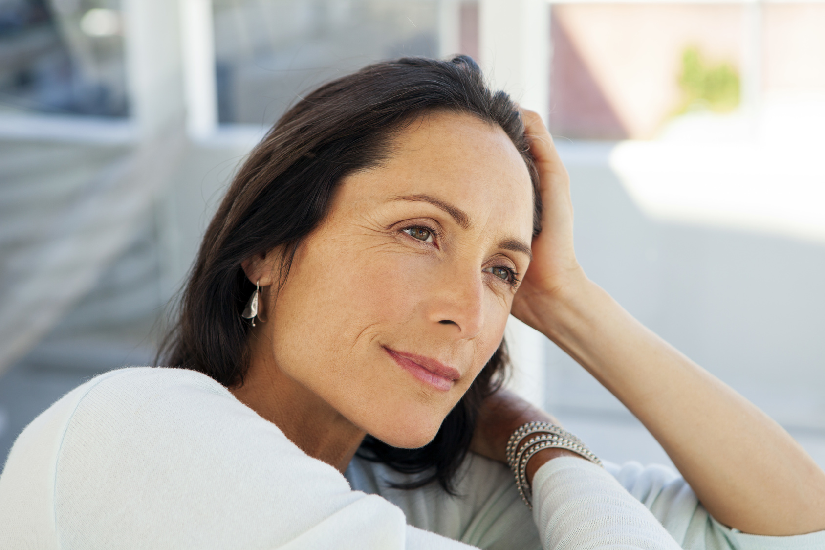 woman looking away - beautiful pensive middle aged person - close up portrait
