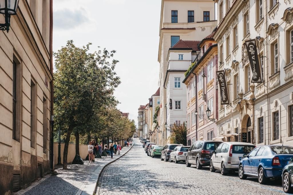 People walking on the cobblestone street in the Old Town in Prague, Czech Republic.